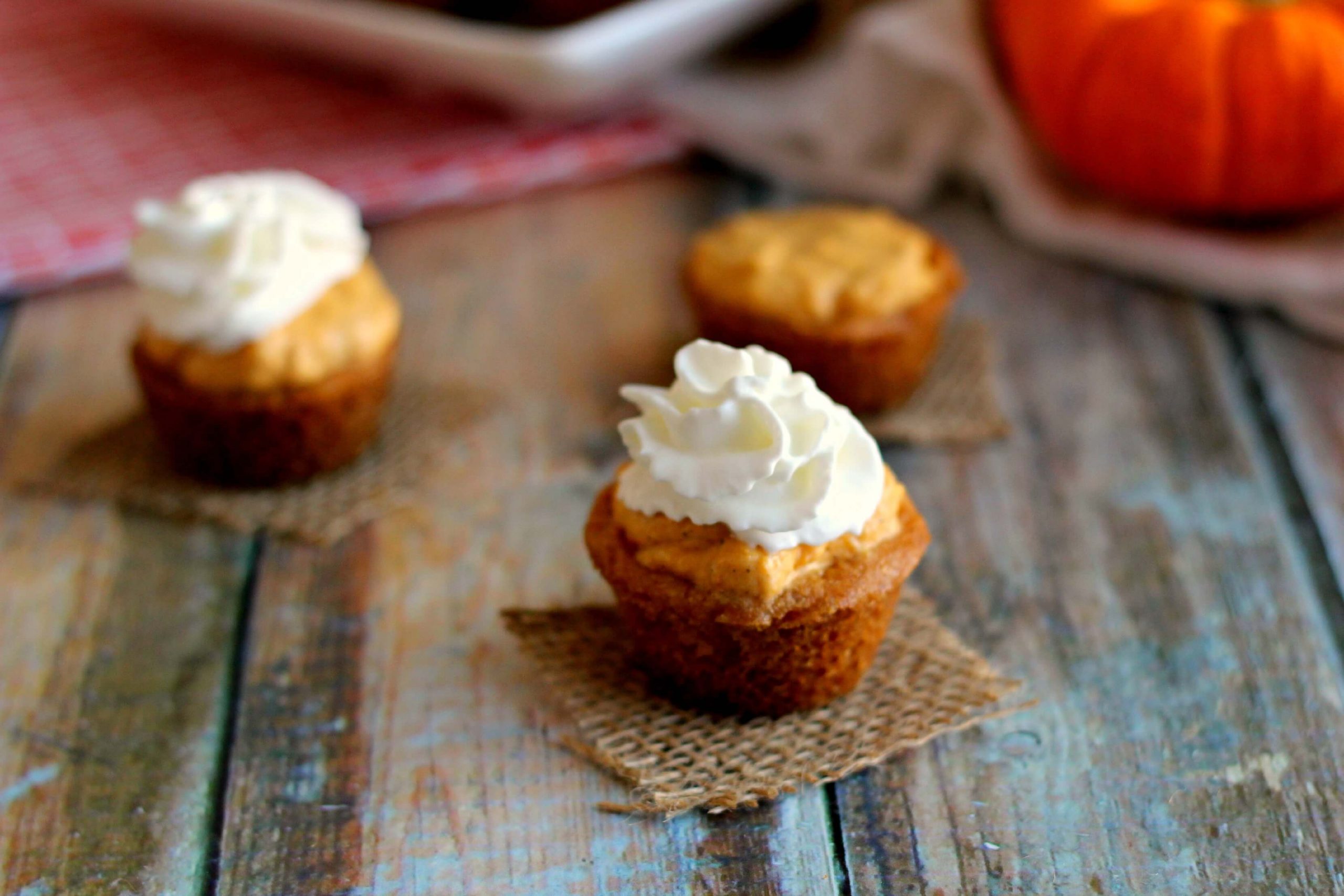 pumpkie pie bites with whipped cream on top