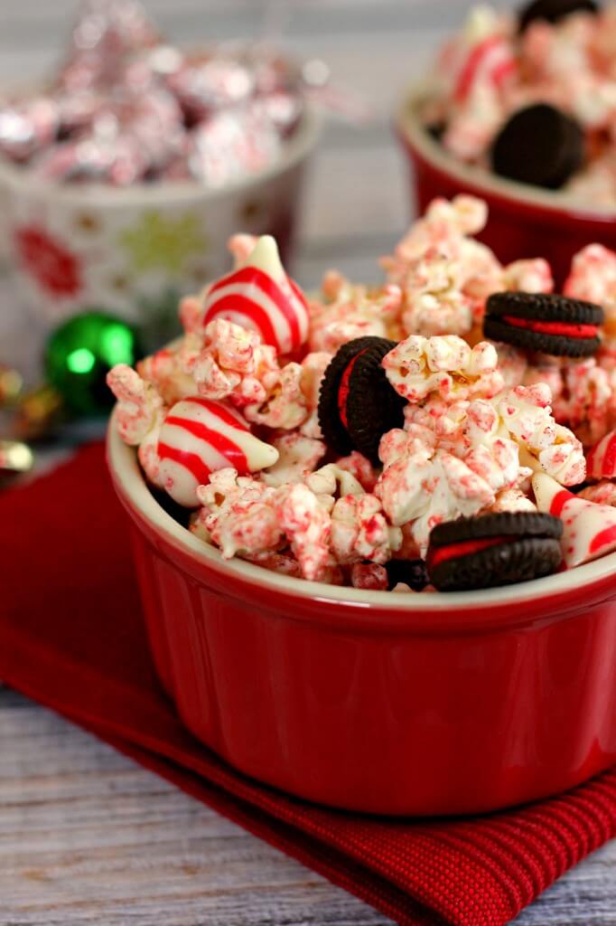 This White Chocolate Candy Cane Popcorn is coated with white chocolate and tossed with candy cane Oreos and candy cane kisses to provide a tasty snack.