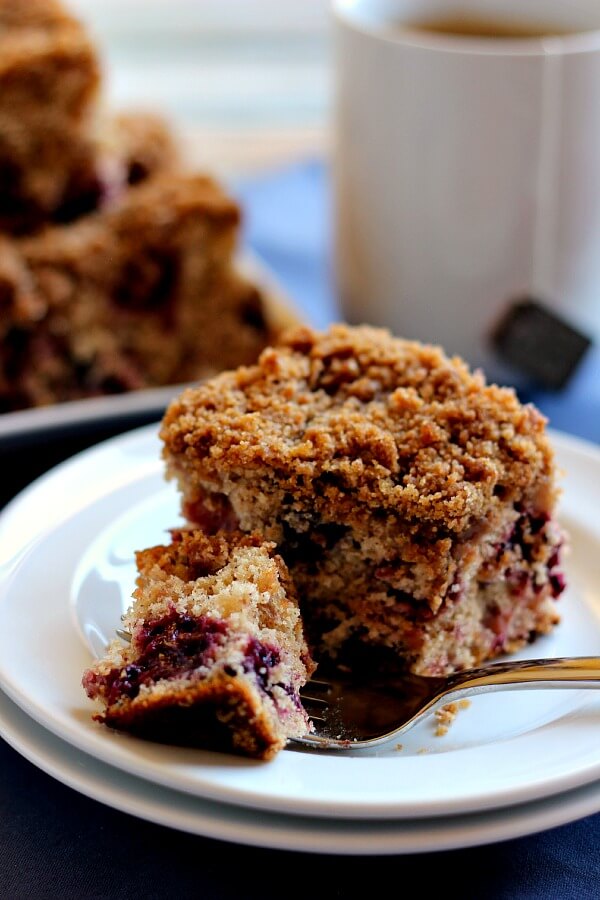 Bursting with strawberries, blueberries, blackberries, and raspberries, this Mixed Berry Coffee Cake is moist and light, with cinnamon sprinkled in.