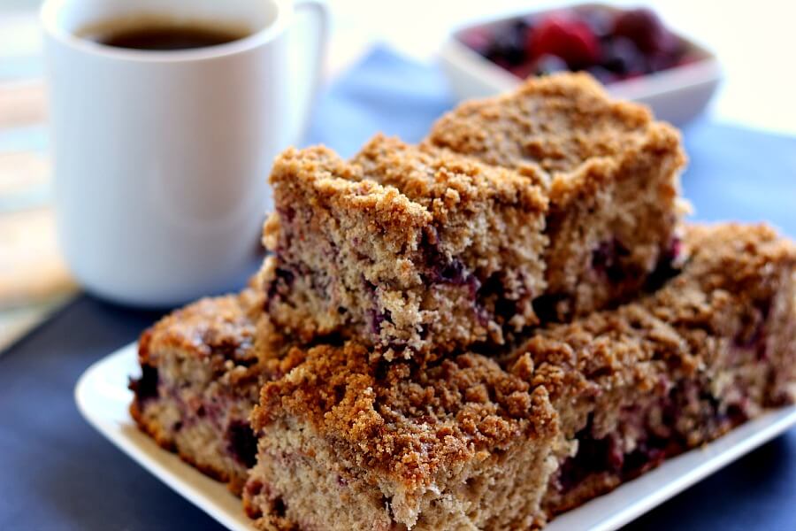 Bursting with strawberries, blueberries, blackberries, and raspberries, this Mixed Berry Coffee Cake is moist and light, with cinnamon sprinkled in.