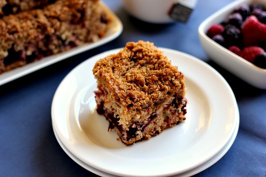 Bursting with strawberries, blueberries, blackberries, and raspberries, this Mixed Berry Coffee Cake is moist and light, with cinnamon sprinkled in.