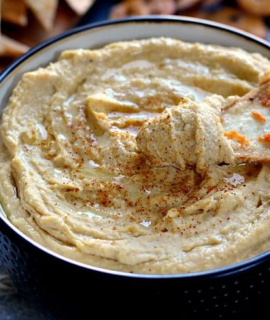 Healthier than the store-bought kind and so easy to make, this Whipped Garlic Hummus will be your new favorite dip!