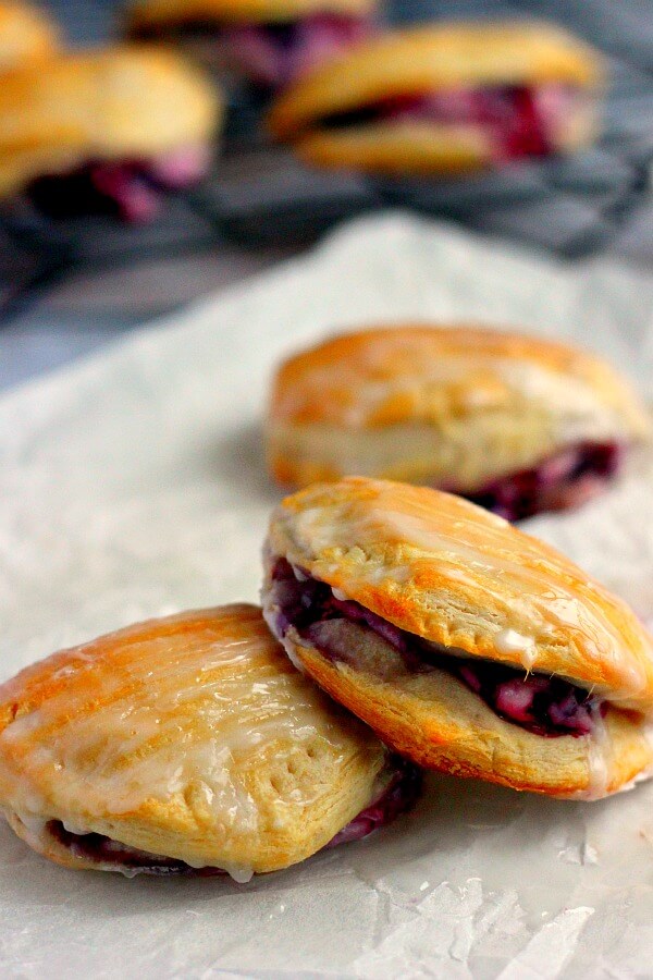 Light, fluffy, and bursting with a creamy fruit center, these Berry Cream Cheese Turnovers are perfect for breakfast, a mid-morning snack, or dessert!