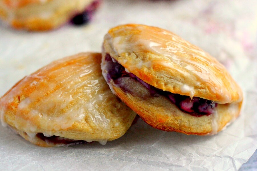 Light, fluffy, and bursting with a creamy fruit center, these Berry Cream Cheese Turnovers are perfect for breakfast, a mid-morning snack, or dessert!