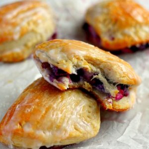 Light, fluffy, and bursting with a creamy fruit center, these Berry Cream Cheese Turnovers are perfect for breakfast, a mid-morning snack, or dessert!