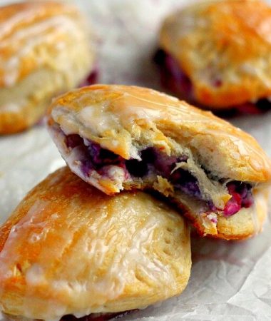 Light, fluffy, and bursting with a creamy fruit center, these Berry Cream Cheese Turnovers are perfect for breakfast, a mid-morning snack, or dessert!
