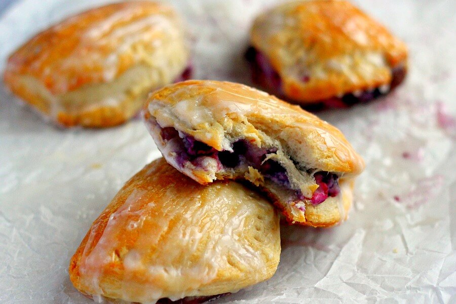 Light, fluffy, and bursting with a creamy fruit center, these Berry Cream Cheese Turnovers are perfect for breakfast, a mid-morning snack, or dessert!