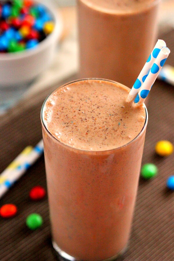This Chocolate Peanut Butter Crunch Shake is filled with vanilla ice cream, decadent chocolate syrup, peanut butter, and M&M's® Crispy.