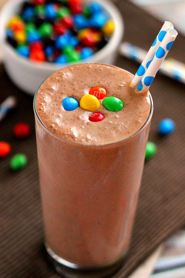 This Chocolate Peanut Butter Crunch Shake is filled with vanilla ice cream, decadent chocolate syrup, peanut butter, and M&M's® Crispy.