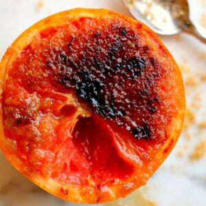 Loaded with flavor, this Caramelized Brown Sugar Grapefruit is broiled to perfection, resulting in a sweet and tangy treat that will tickle your taste buds!