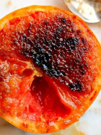 Loaded with flavor, this Caramelized Brown Sugar Grapefruit is broiled to perfection, resulting in a sweet and tangy treat that will tickle your taste buds!