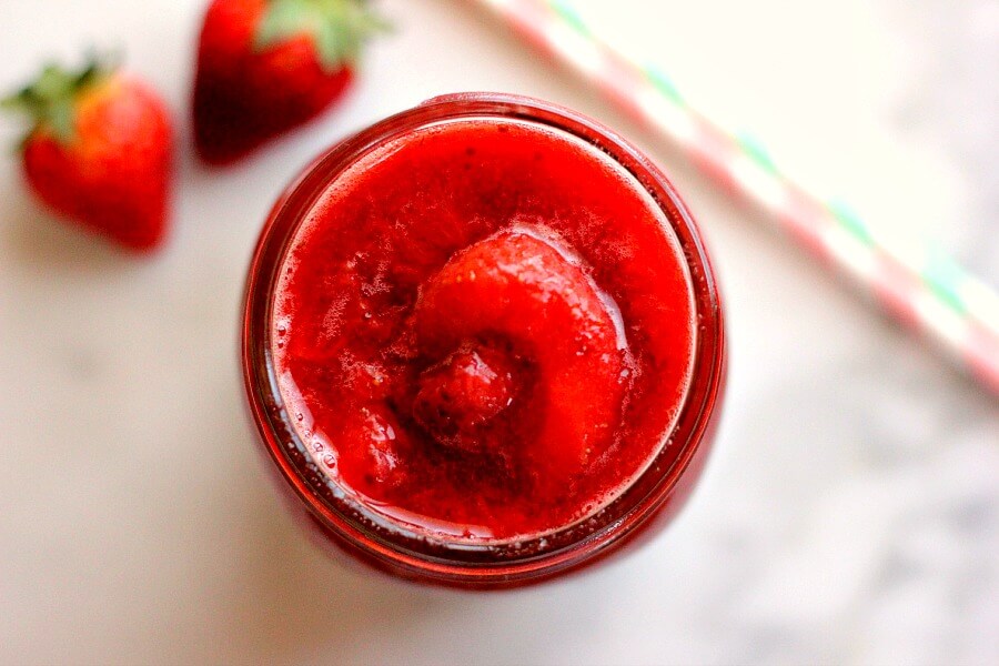 top down view of a jar of fresh strawberry sauce