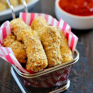Full of melty cheese and packed with flavor, these Baked Mozzarella Sticks are healthier than the fried kind and perfect to satisfy the munchies!