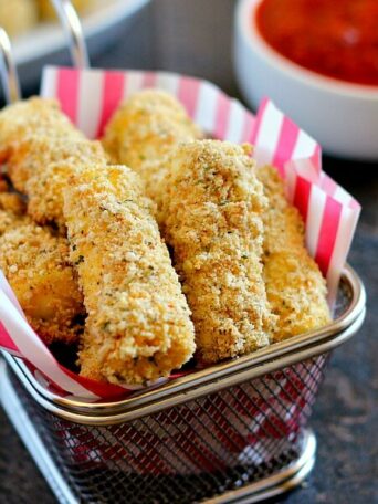 Full of melty cheese and packed with flavor, these Baked Mozzarella Sticks are healthier than the fried kind and perfect to satisfy the munchies!