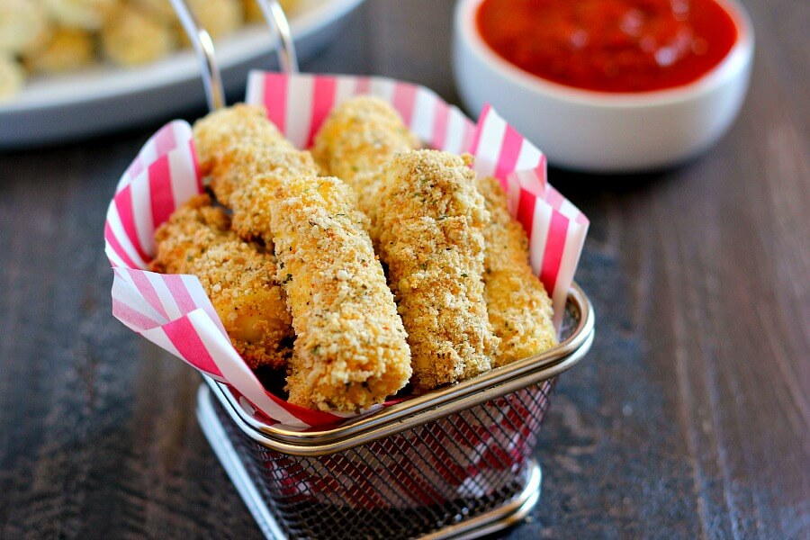 Full of melty cheese and packed with flavor, these Baked Mozzarella Sticks are healthier than the fried kind and perfect to satisfy the munchies!