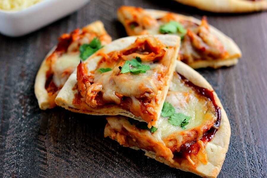 Filled with tender chicken, tangy barbecue sauce, and Mozzarella cheese, this Barbecue Chicken Pita Pizza is the perfect option for when hunger strikes!