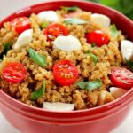 Filled with hearty quinoa, fresh tomatoes, creamy mozzarella, and basil, this Quinoa Caprese Salad combines the classic flavors into a healthier dish. It's easy to make, packed with protein, and is bursting with flavor!