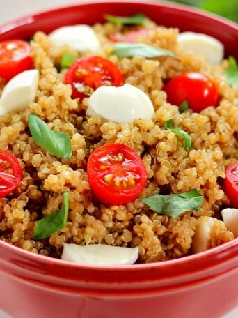 Filled with hearty quinoa, fresh tomatoes, creamy mozzarella, and basil, this Quinoa Caprese Salad combines the classic flavors into a healthier dish. It's easy to make, packed with protein, and is bursting with flavor!