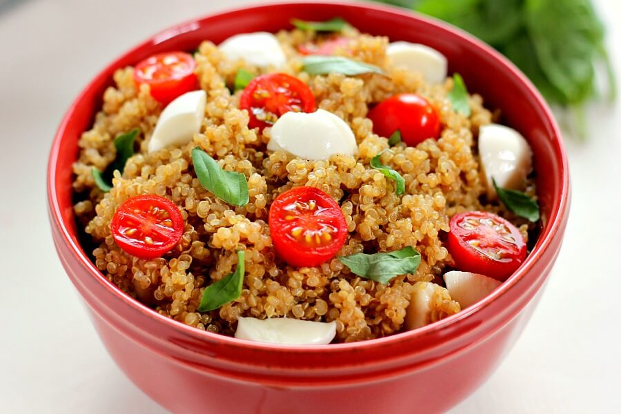 Filled with hearty quinoa, fresh tomatoes, creamy mozzarella, and basil, this Quinoa Caprese Salad combines the classic flavors into a healthier dish. It's easy to make, packed with protein, and is bursting with flavor!