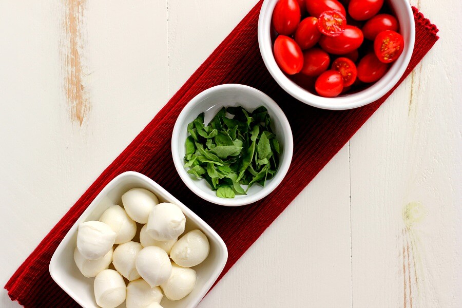 Filled with hearty quinoa, fresh tomatoes, creamy mozzarella, and basil, this Quinoa Caprese Salad combines the classic flavors into a healthier dish. It's easy to make, packed with protein, and is bursting with flavor!