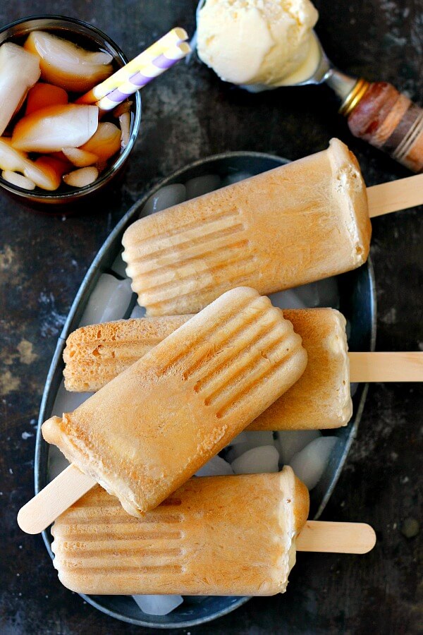 These Root Beer Popsicles taste just like a classic root beer float, but in frozen form. Filled with sweet root beer and creamy vanilla ice cream, these popsicles are the perfect treat to beat the heat!