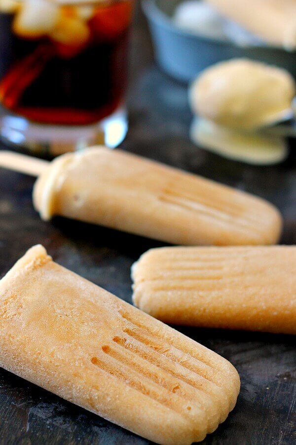 These Root Beer Popsicles taste just like a classic root beer float, but in frozen form. Filled with sweet root beer and creamy vanilla ice cream, these popsicles are the perfect treat to beat the heat!