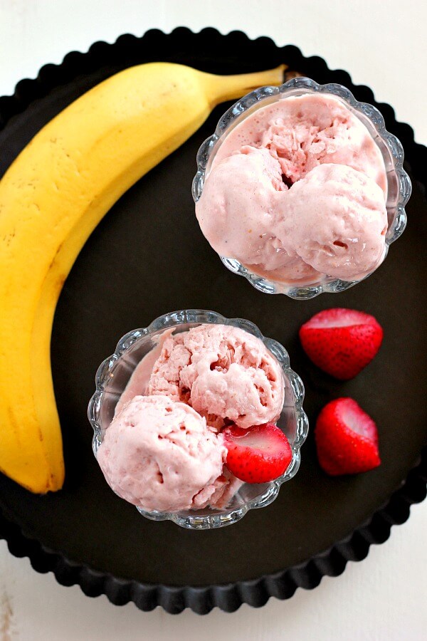This Strawberry Banana Frozen Yogurt is creamy, packed with protein, and contains just four ingredients. It's also a fraction of the calories that you would find at frozen yogurt shop and tastes twice as good!