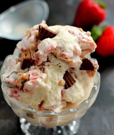 This Strawberry Peanut Butter Swirl Ice Cream is loaded with juicy strawberries and creamy peanut butter, swirled into sweet vanilla cream and then topped with peanut butter cups. And best of all, it's made without an ice cream maker!