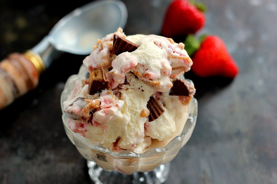 This Strawberry Peanut Butter Swirl Ice Cream is loaded with juicy strawberries and creamy peanut butter, swirled into sweet vanilla cream and then topped with peanut butter cups. And best of all, it's made without an ice cream maker!