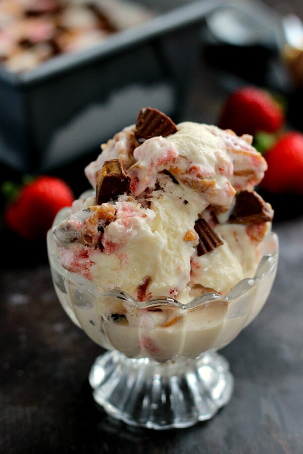 This Strawberry Peanut Butter Swirl Ice Cream is loaded with juicy strawberries and creamy peanut butter, swirled into sweet vanilla cream and then topped with peanut butter cups. And best of all, it's made without an ice cream maker!