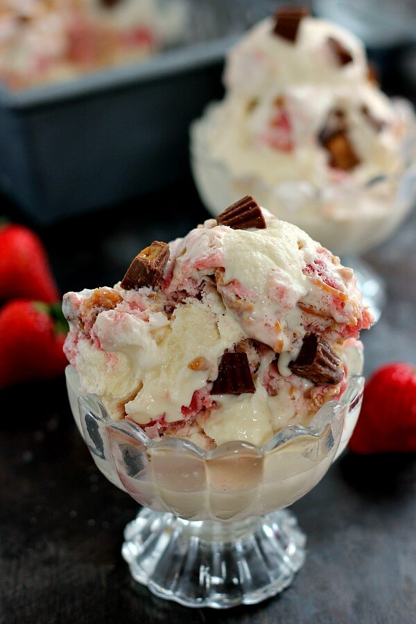 This Strawberry Peanut Butter Swirl Ice Cream is loaded with juicy strawberries and creamy peanut butter, swirled into sweet vanilla cream and then topped with peanut butter cups. And best of all, it's made without an ice cream maker!