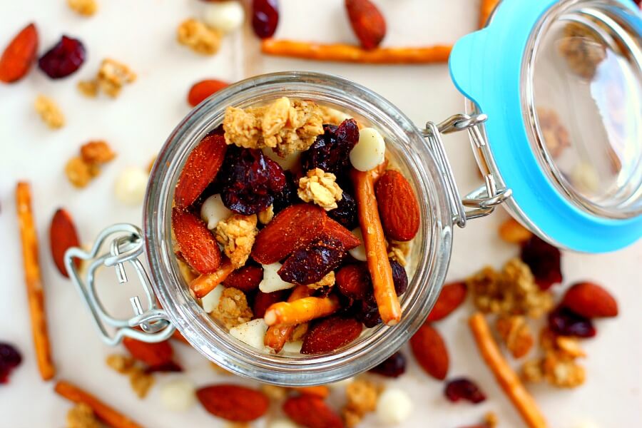 Filled with Sriracha Blue Diamond Almonds, crunchy granola, pretzels, dried cranberries, and white chocolate, this Sweet and Spicy Trail Mix has the perfect combination of sweet and spicy ingredients!