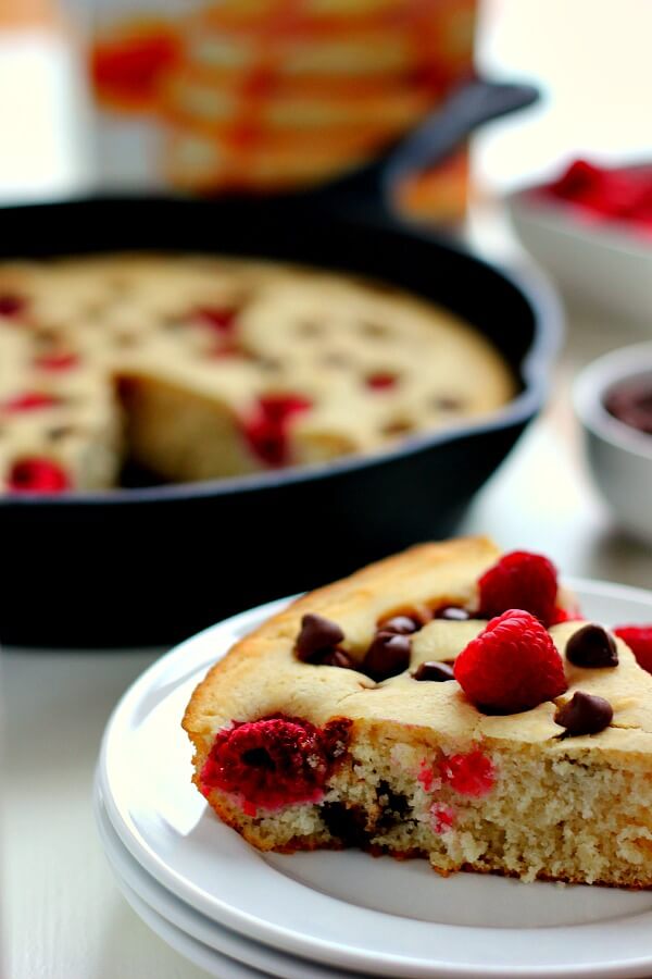 Fluffy, light and bursting with fresh raspberries and chocolate chips, this Baked Raspberry Chocolate Chip Pancake uses Krusteaz's Buttermilk Pancake Mix and is ready in less than thirty minutes. It's sweet enough to eat on its own or sprinkled with some powdered sugar or syrup!