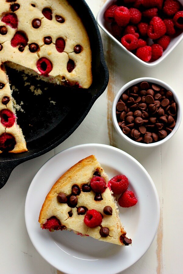 Fluffy, light and bursting with fresh raspberries and chocolate chips, this Baked Raspberry Chocolate Chip Pancake uses Krusteaz's Buttermilk Pancake Mix and is ready in less than thirty minutes. It's sweet enough to eat on its own or sprinkled with some powdered sugar or syrup!