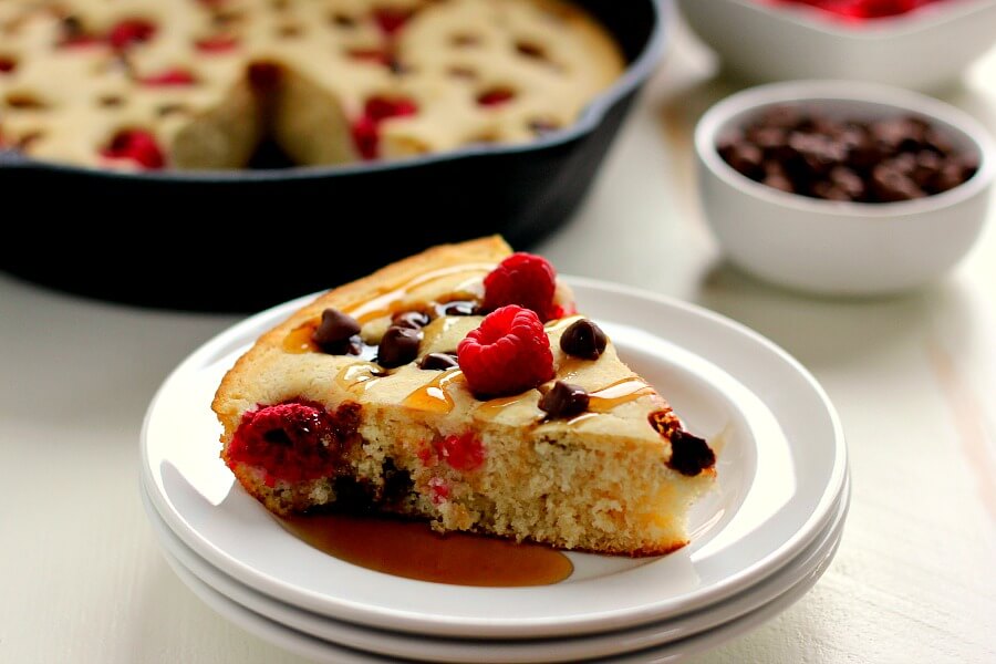 Fluffy, light and bursting with fresh raspberries and chocolate chips, this Baked Raspberry Chocolate Chip Pancake uses Krusteaz's Buttermilk Pancake Mix and is ready in less than thirty minutes. It's sweet enough to eat on its own or sprinkled with some powdered sugar or syrup!