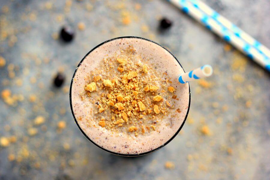 This Caramel Blueberry Pie Milkshake is filled with sweet vanilla bean ice cream, rich caramel, and Dark Chocolate Blueberries from Brookside. It's creamy, delicious, and the perfect frozen treat to satisfy your ice cream cravings!