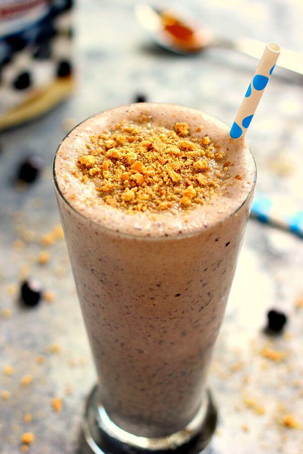 This Caramel Blueberry Pie Milkshake is filled with sweet vanilla bean ice cream, rich caramel, and Dark Chocolate Blueberries from Brookside. It's creamy, delicious, and the perfect frozen treat to satisfy your ice cream cravings!