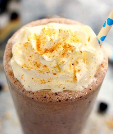 This Caramel Blueberry Pie Milkshake is filled with sweet vanilla bean ice cream, rich caramel, and Dark Chocolate Blueberries from Brookside. It's creamy, delicious, and the perfect frozen treat to satisfy your ice cream cravings!