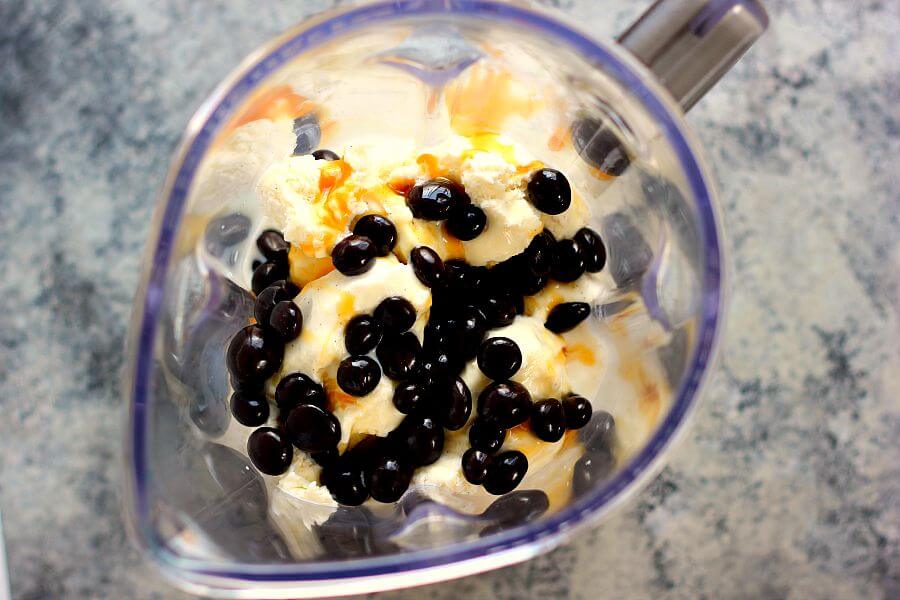This Caramel Blueberry Pie Milkshake is filled with sweet vanilla bean ice cream, rich caramel, and Dark Chocolate Blueberries from Brookside. It's creamy, delicious, and the perfect frozen treat to satisfy your ice cream cravings!