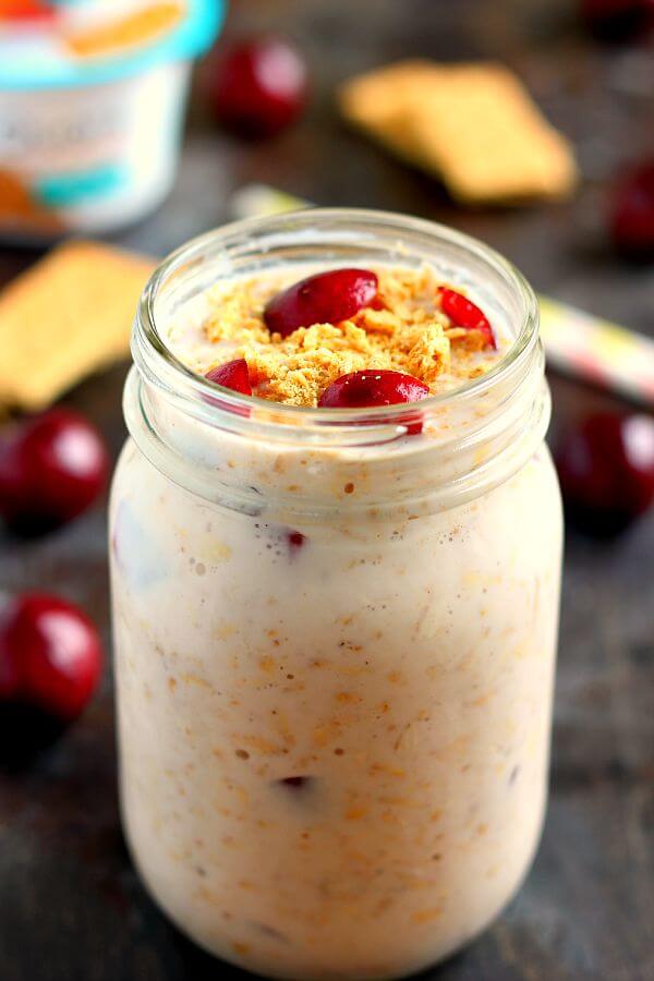 A mason jar filled with cherry overnight oats.