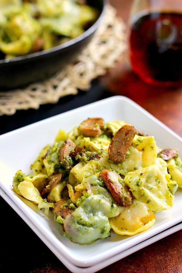 This Pesto Tortellini Bake is filled with fresh pasta, tangy pesto sauce, juicy mushrooms, and mozzarella cheese. It easy to prepare and makes the perfect weeknight meal!