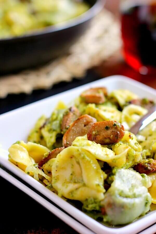 This Pesto Tortellini Bake is filled with fresh pasta, tangy pesto sauce, juicy mushrooms, and mozzarella cheese. It easy to prepare and makes the perfect weeknight meal!