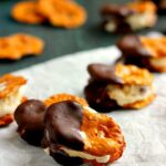 These Pretzel Ice Cream Bites are filled with peanut butter cup ice cream that is sandwiched between two Snack Factory Pretzel Crisps® and then dunked in chocolate. It's the perfect poppable, crunchy, and delicious treat!