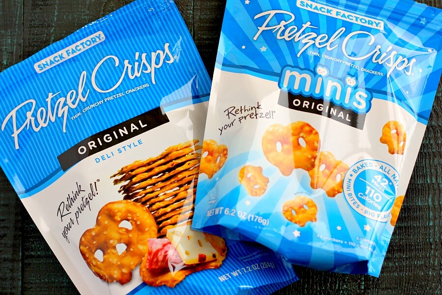 These Pretzel Ice Cream Bites are filled with peanut butter cup ice cream that is sandwiched between two Snack Factory Pretzel Crisps® and then dunked in chocolate. It's the perfect poppable, crunchy, and delicious treat!
