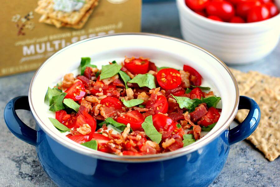 Loaded with the classic toppings of bacon, lettuce, and tomato, this Skinny BLT Ranch Dip is made with a Greek yogurt base and swirled with hints of ranch dressing. 