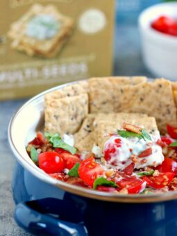 Loaded with the classic toppings of bacon, lettuce, and tomato, this Skinny BLT Ranch Dip is made with a Greek yogurt base and swirled with hints of ranch dressing.