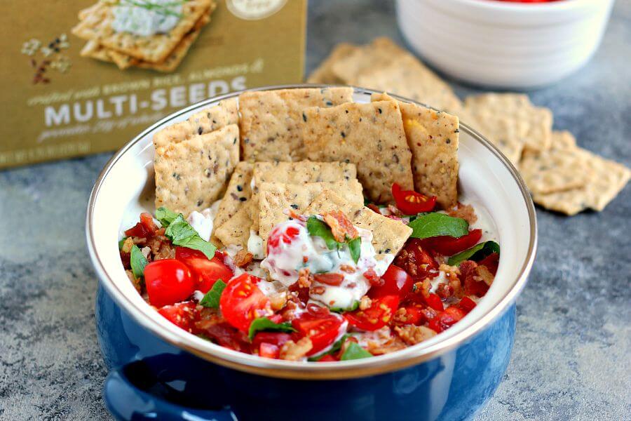 Loaded with the classic toppings of bacon, lettuce, and tomato, this Skinny BLT Ranch Dip is made with a Greek yogurt base and swirled with hints of ranch dressing. 