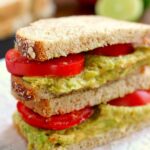 This Smashed Chickpea and Avocado Sandwich is loaded with flavor and makes a light and healthy lunch or dinner. Chickpeas and avocados make the perfect pair when blended with a touch of spice and lime juice!