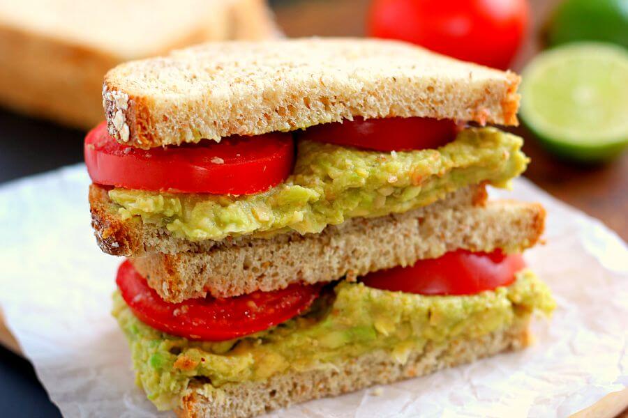 This Smashed Chickpea and Avocado Sandwich is loaded with flavor and makes a light and healthy lunch or dinner. Chickpeas and avocados make the perfect pair when blended with a touch of spice and lime juice!