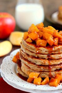 zoomed in shot of apple cinnamon pancakes on a plate